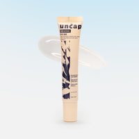 Tube of uncap eye cream with brand name on a light blue background