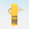 Uncap skincare product with Vitamin C Skin Brightening branding on a light blue background